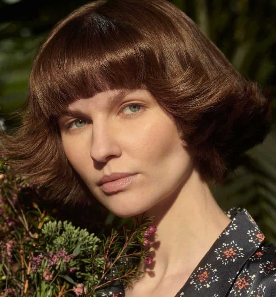 feathered bob with blunt bangs