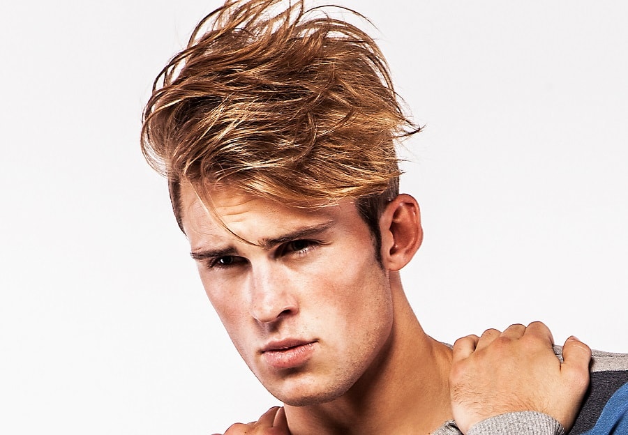 feathered hairstyle for men with highlights