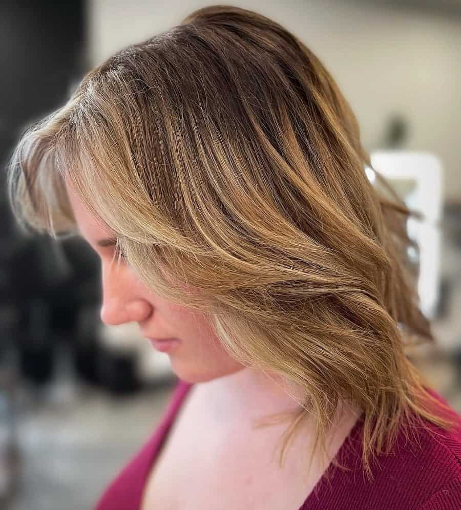feathered hairstyle with curtain bangs