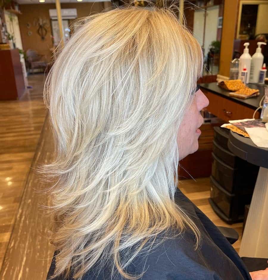 feathered hairstyle with platinum blonde hair