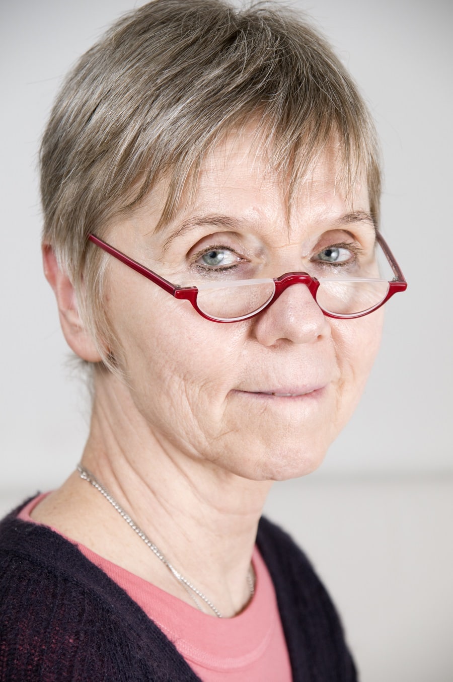 fine pixie haircut for women over 50 with glasses