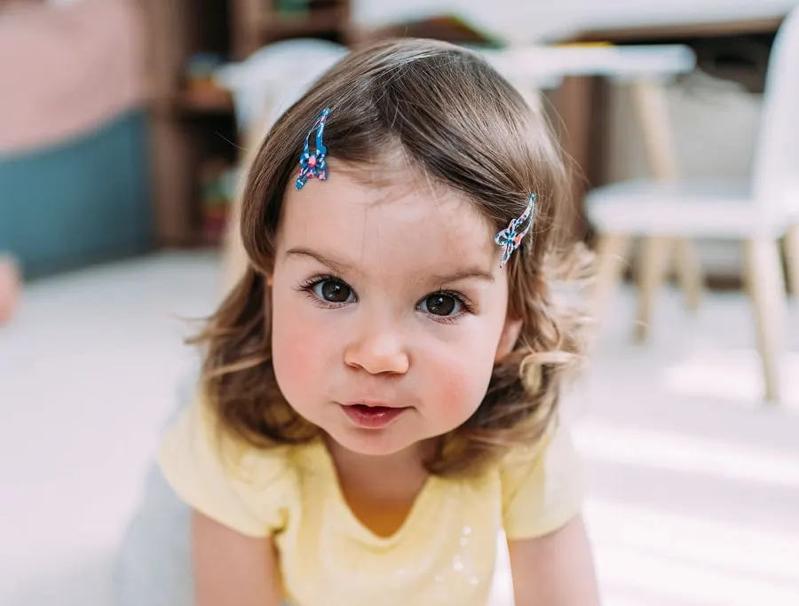 baby girl with first haircut