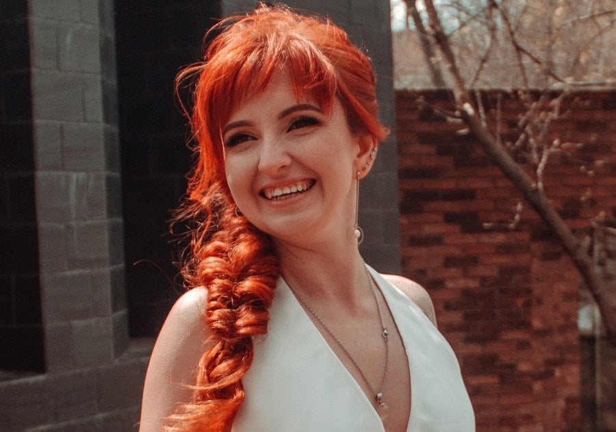 fishtail braid with long red hair