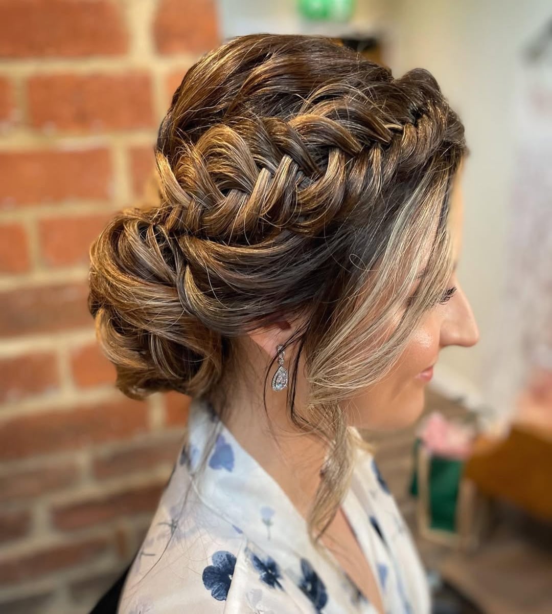 fishtail braided bun on highlighted brown hair