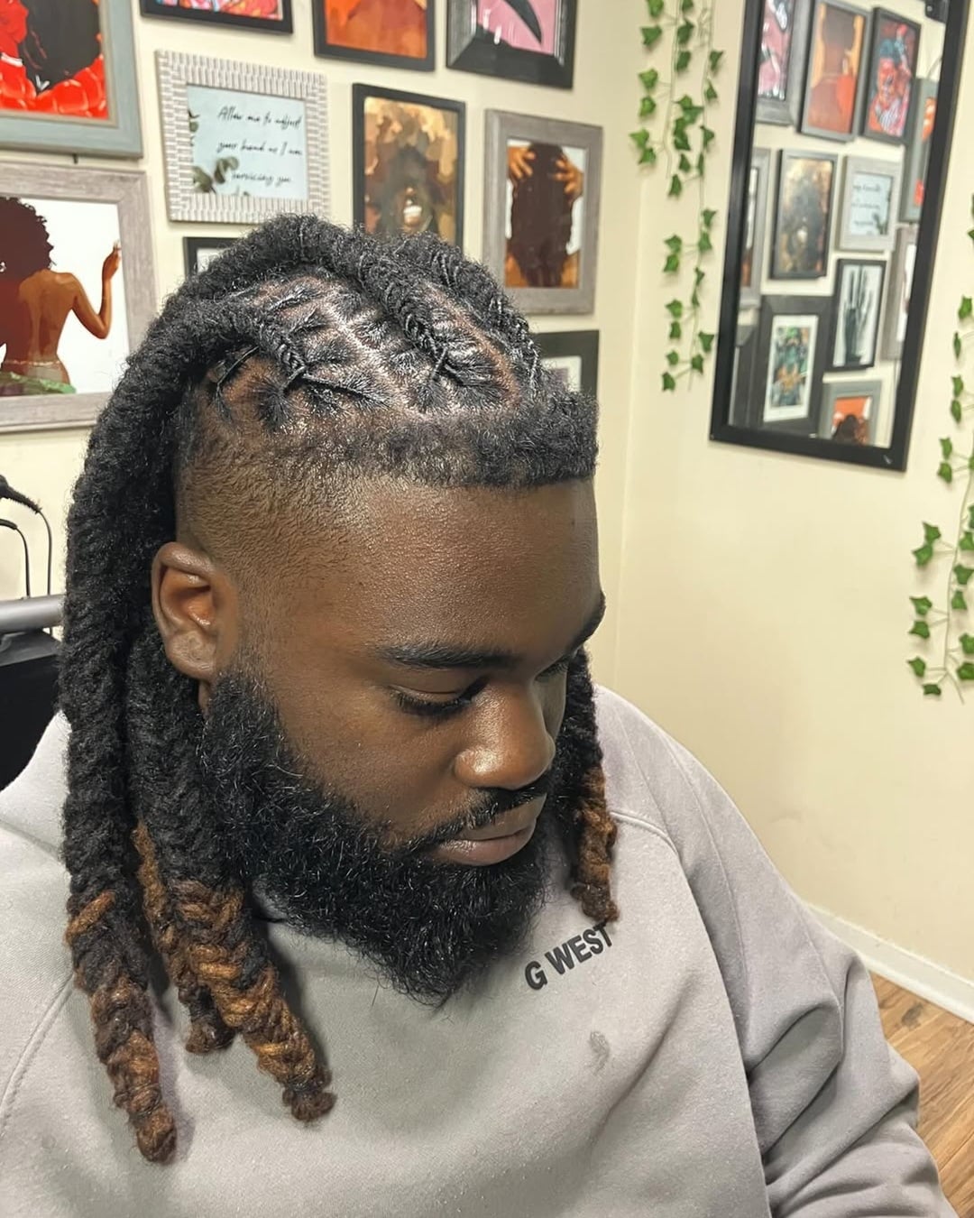 long black fishtail braided locs with brown ombre tips