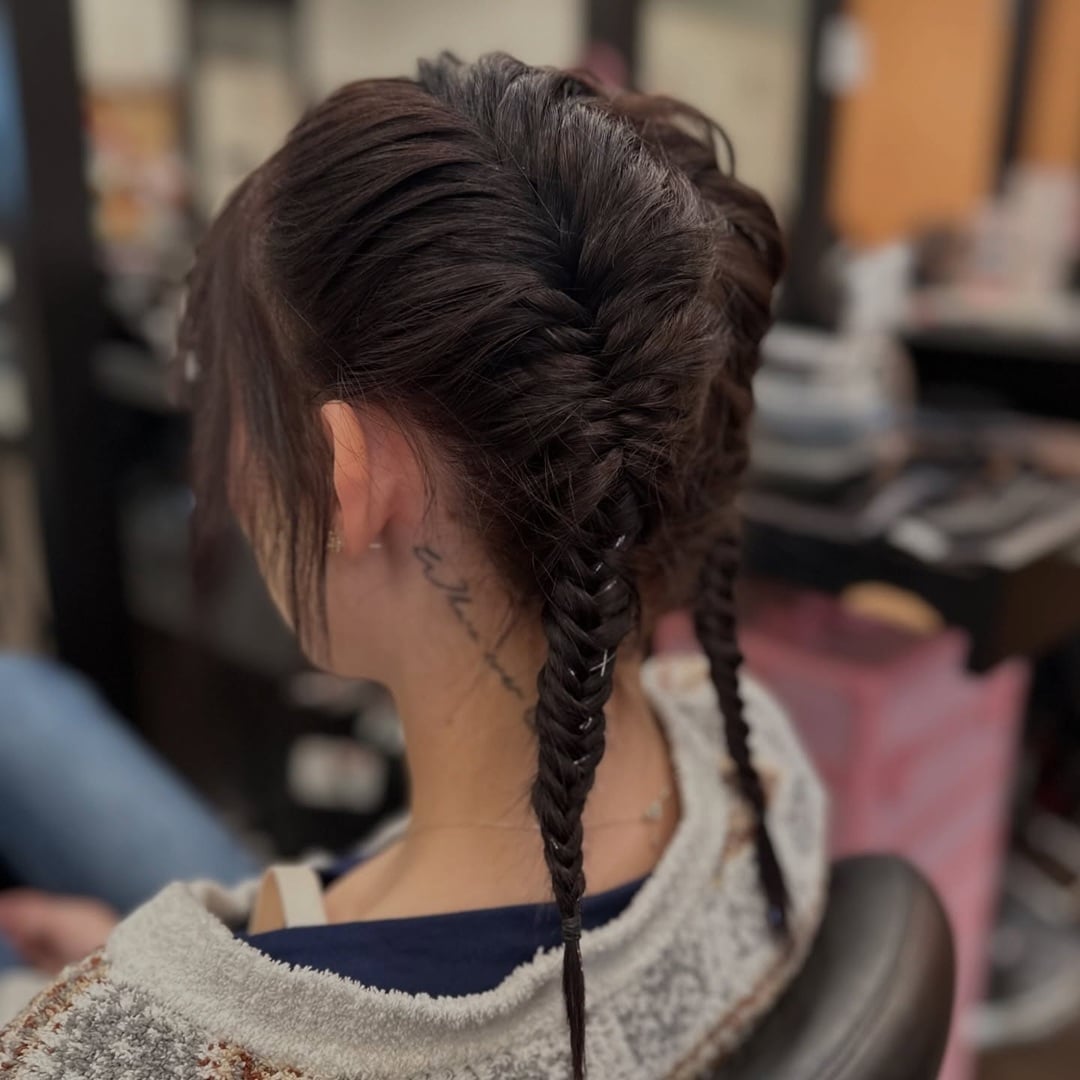 fishtail braided pigtails on dark hair