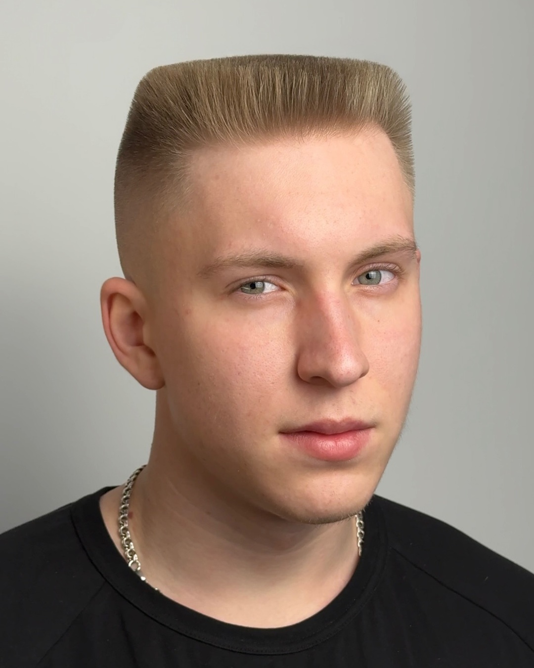 Dirty blonde flat top haircut with a high bald fade