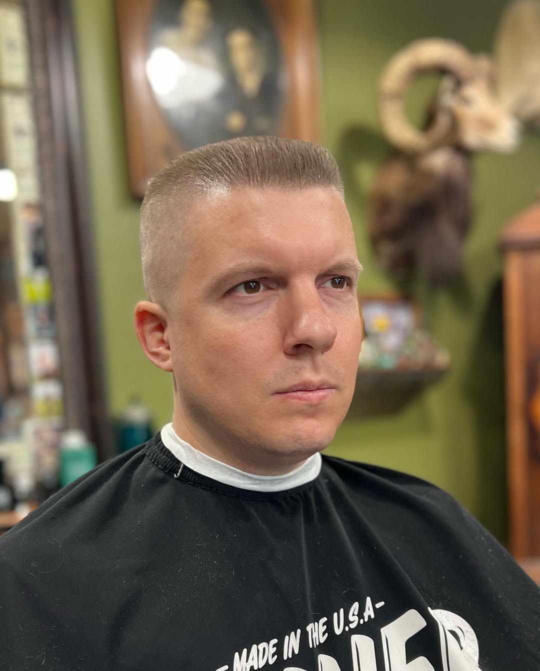 Short flat top haircut with a clean skin fade