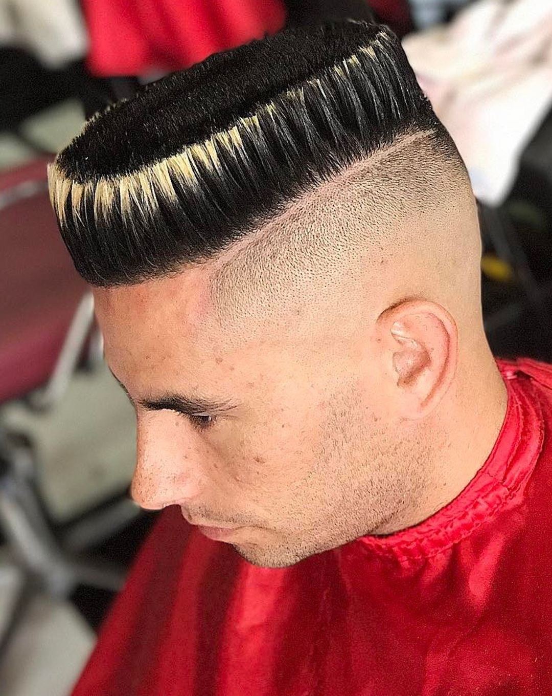 High flat top haircut with a shaved hard part and blonde tips