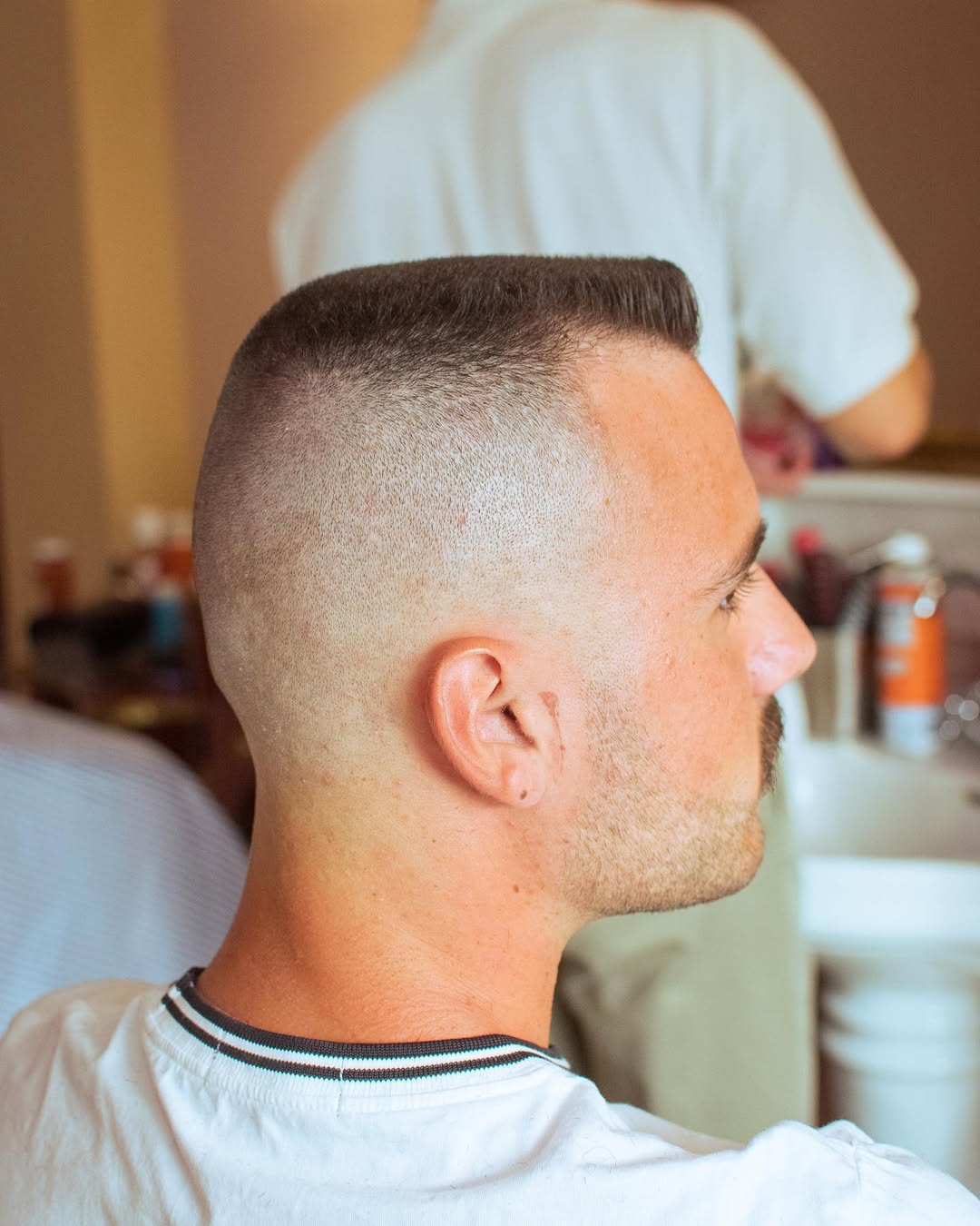 Side profile of classic flat top haircut with a high fade 