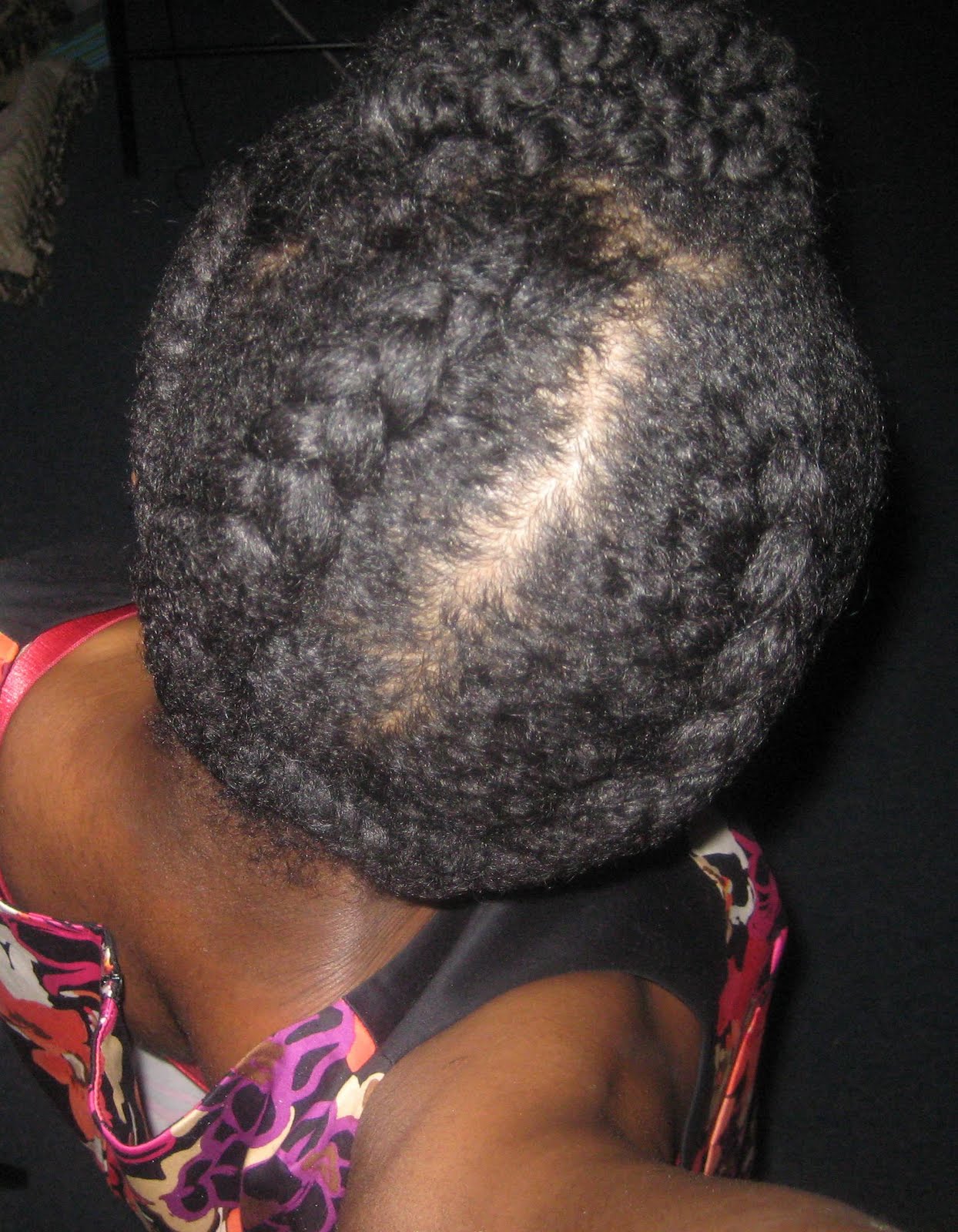 Four-section French-braided updo with paired back braids and tucked ends.