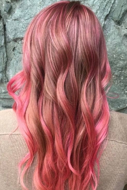 full head pink highlights on long wavy hair