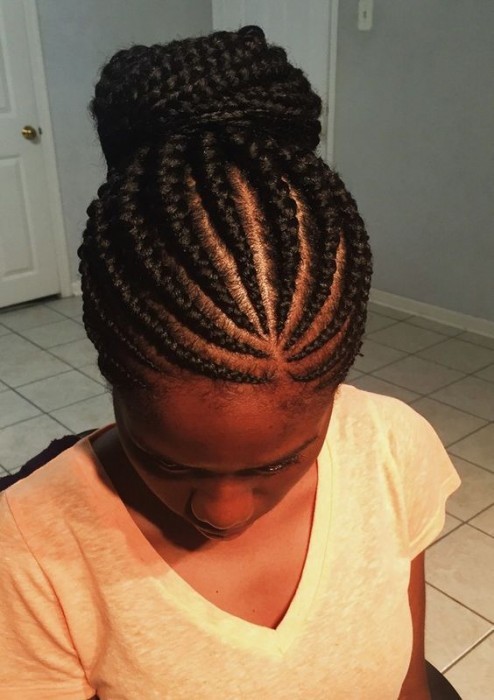 Neat symmetry ghana braids hairstyle for girl 