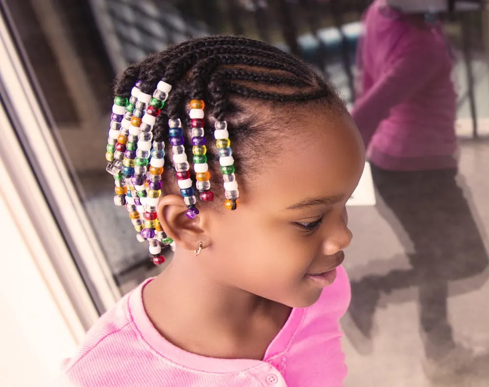 girl's side swept braids with beads