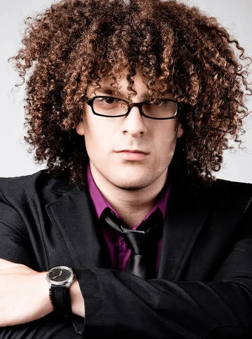 curly hairstyle for men with glasses