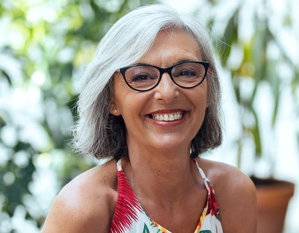 gray bob hairstyle for over 50 with glasses