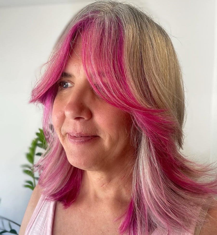 gray hair with face framing pink highlights