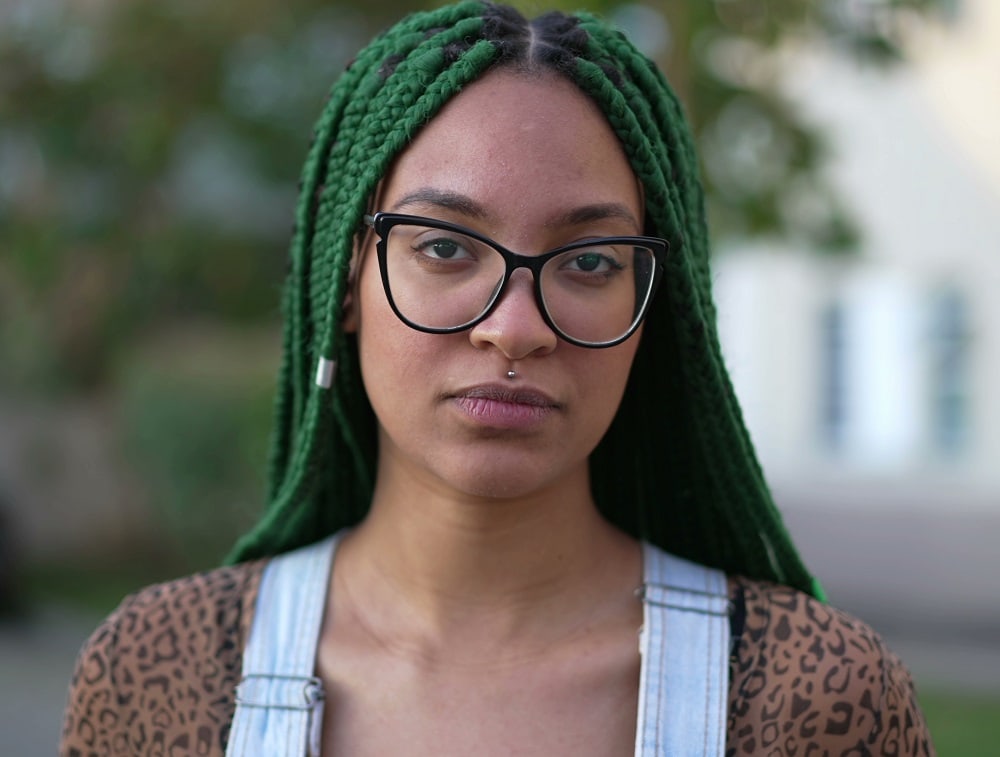 green box braids and glasses