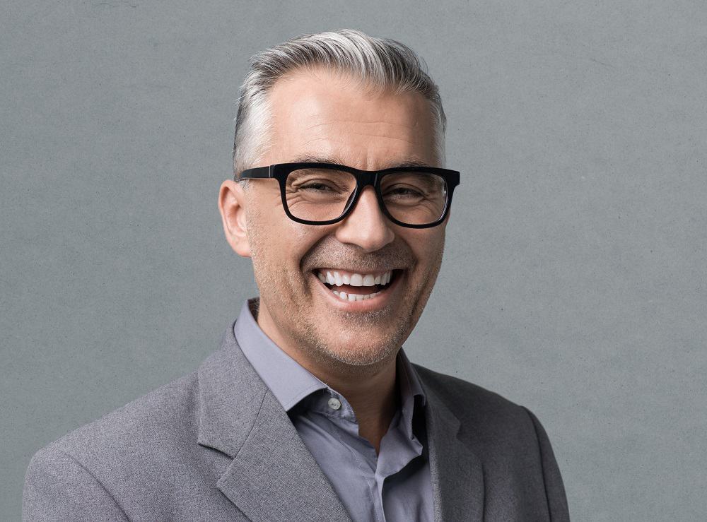 grey hairstyle for men over 50 with glasses