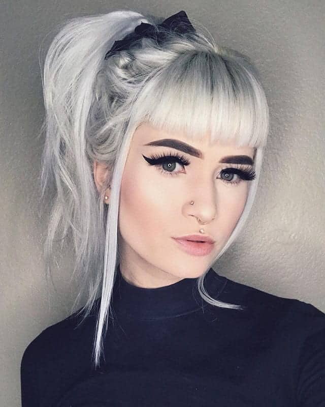 round faced girl with grey ponytail