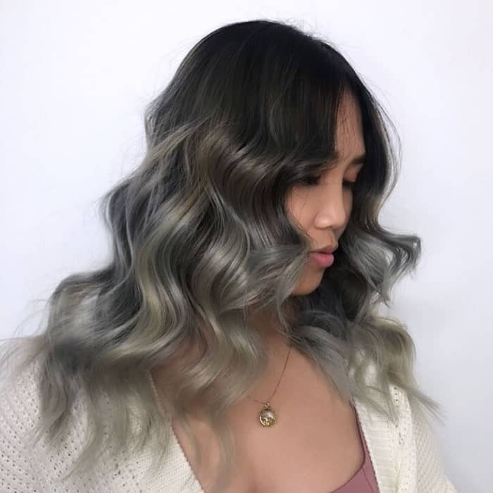 round faced women with long grey wavy hair