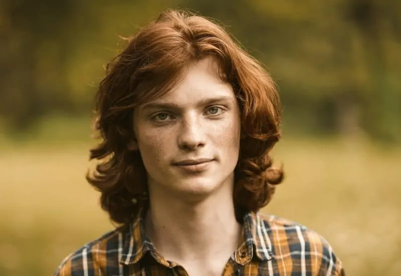 guy with dark ginger red long hair