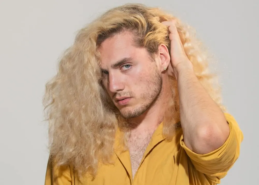 guy with long blonde curly hair