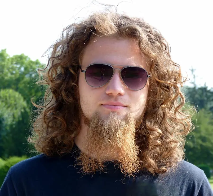 guy with long curly hair and beard