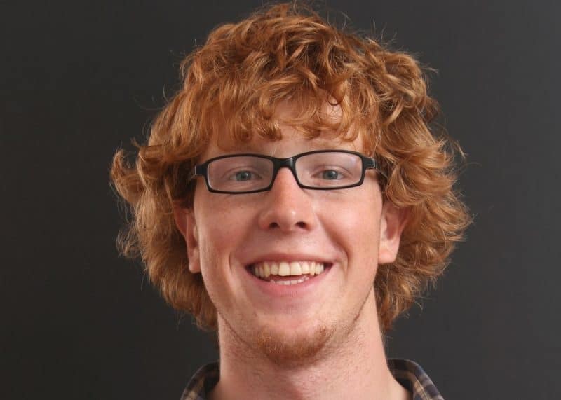 guy with red curly shag haircut