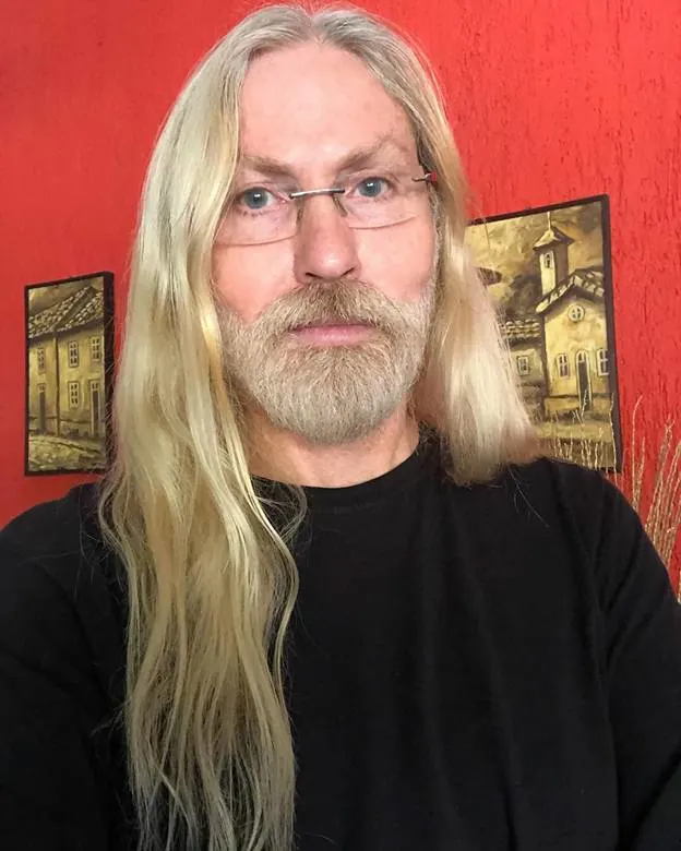older man with long blonde hair
