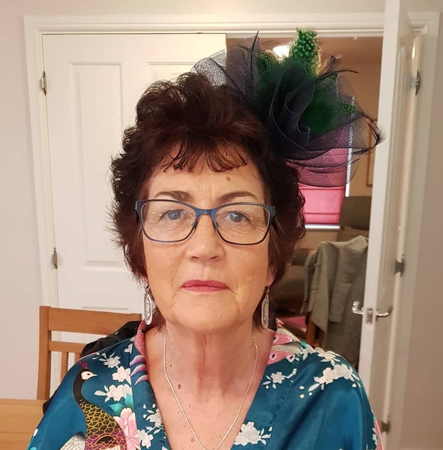 hairstyle with fascinator for bride's mother over 60