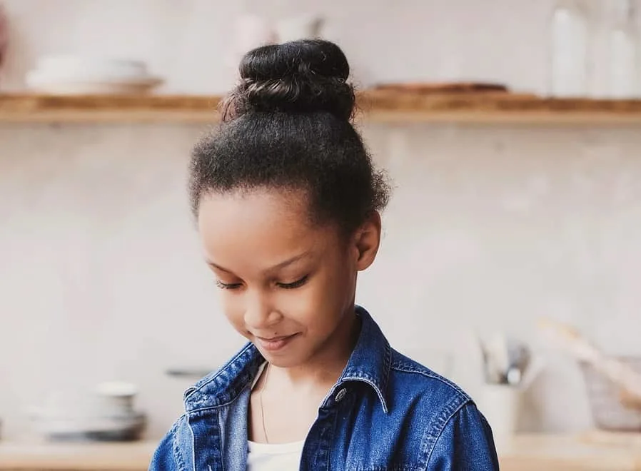 Image of Twisted ballerina bun hairstyle for 9 year olds