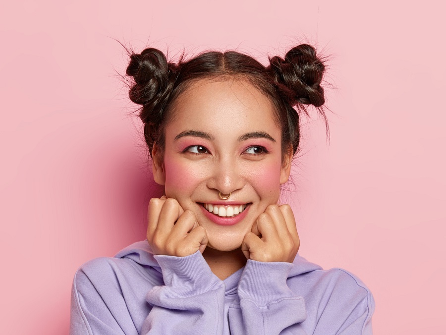 asian woman with space buns