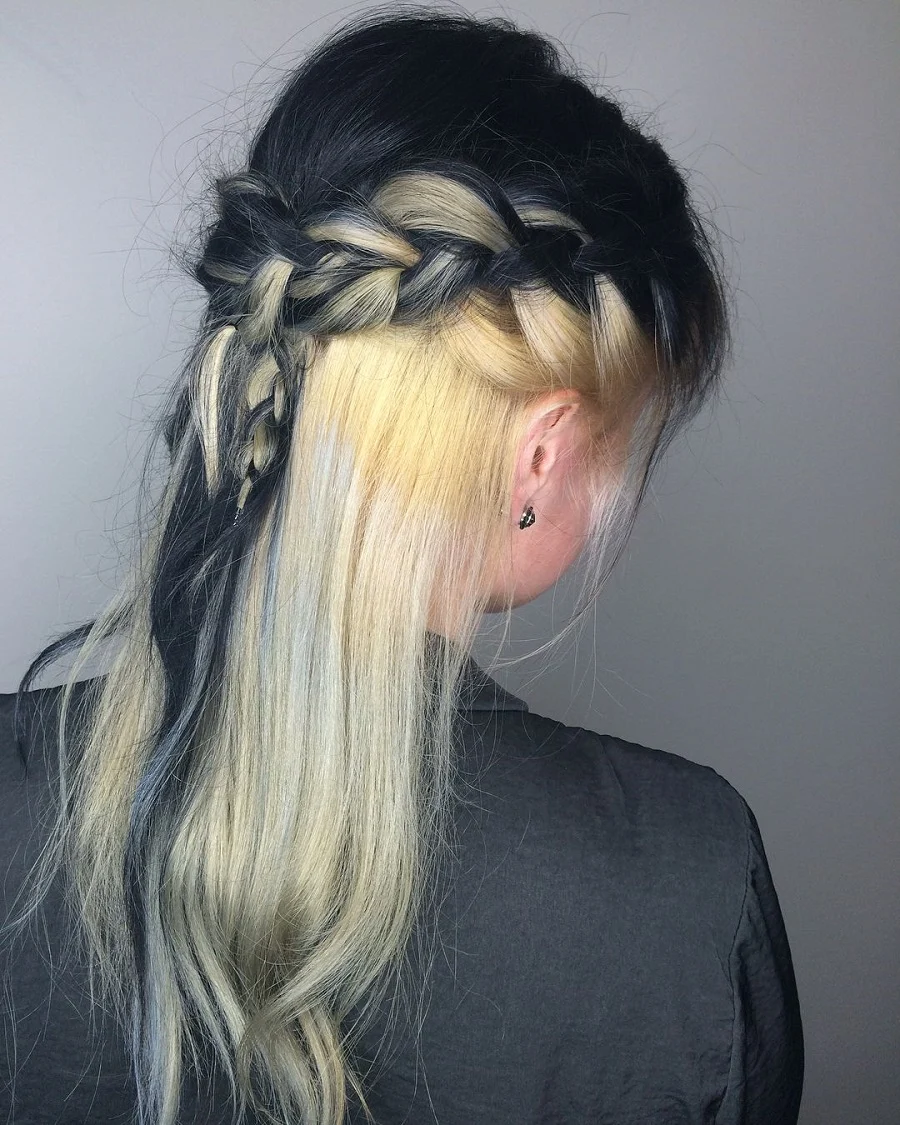 half up black braided hairstyle with blonde underneath