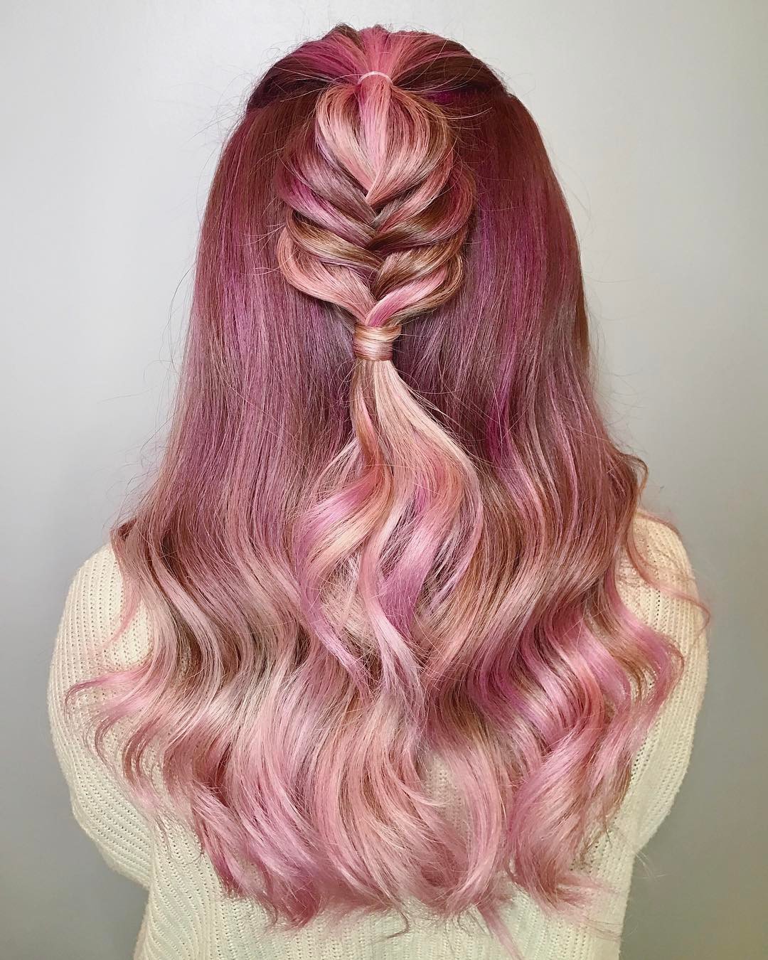 Half-up fishtail braid hairstyle on long hair with dusty mauve and rose gold ombre hair tones