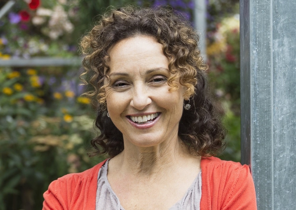 half up curly hairstyle for women over 50