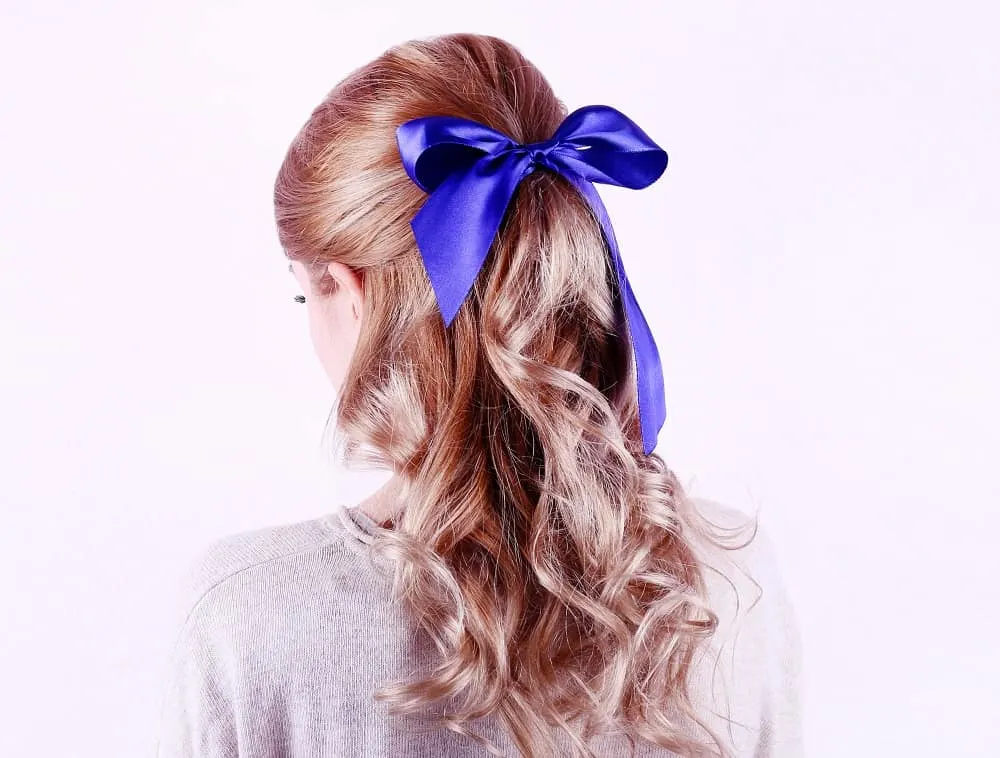 half up curly ponytail