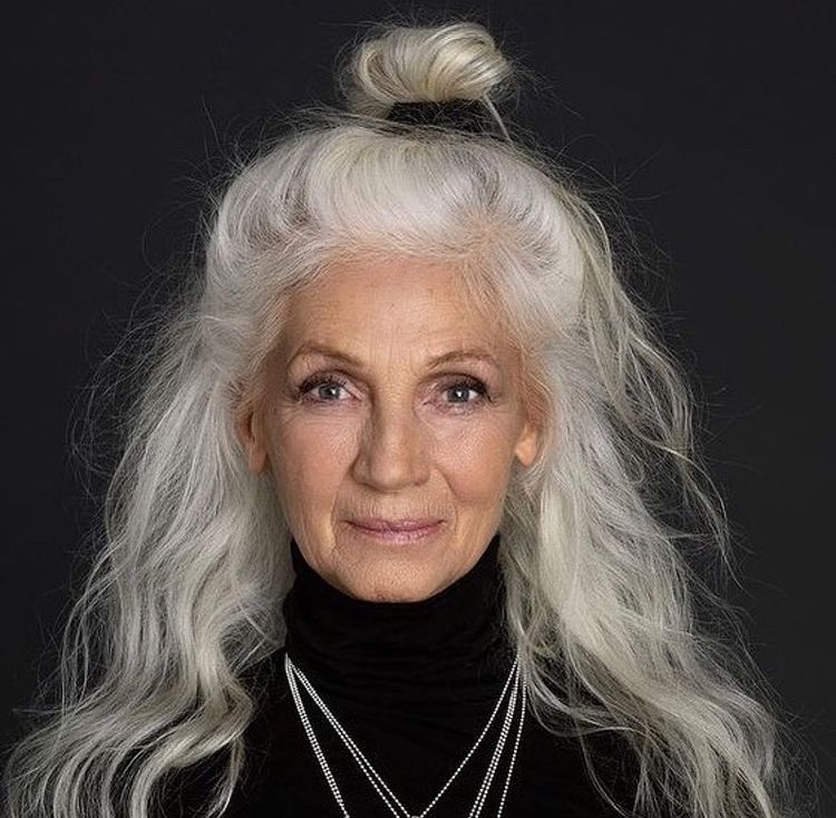 half up grey hairstyle for women over 50