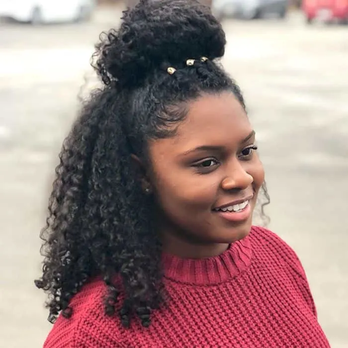 Image of Half-up half-down ponytail with curls curly hair