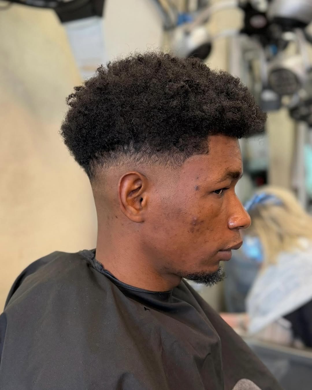 high top curly fade hairstyle for black men with round face