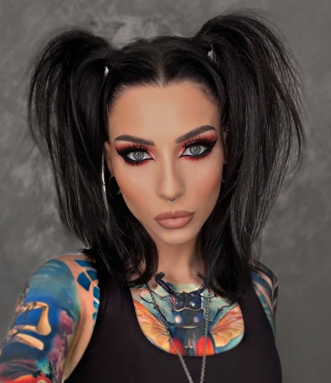 Woman with voluminous high pigtails on medium length hair