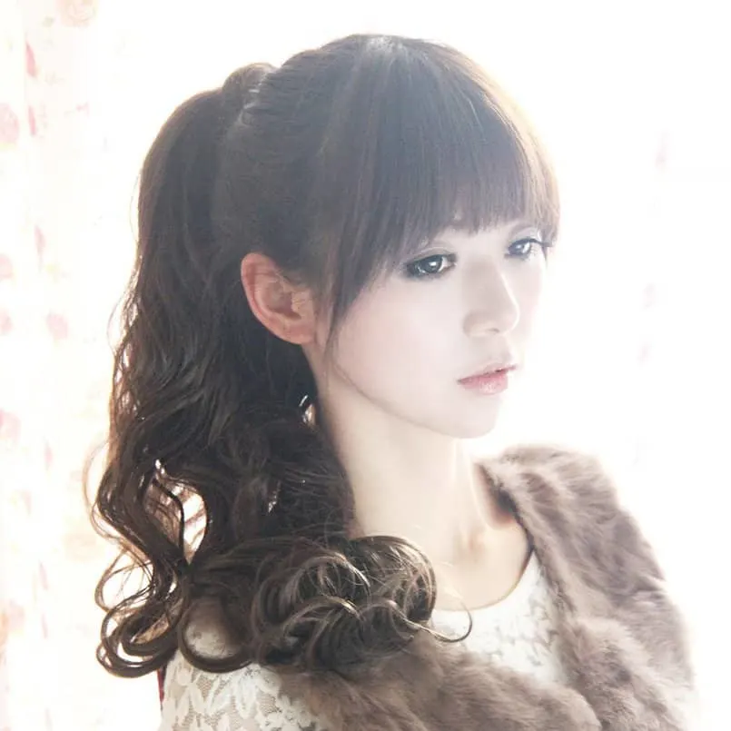 high ponytail with bangs