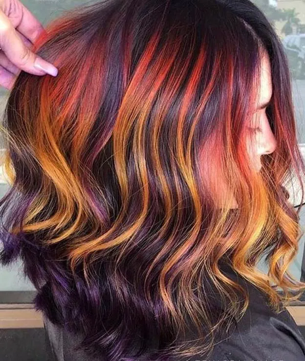 vibrant orange highlights for long hair 