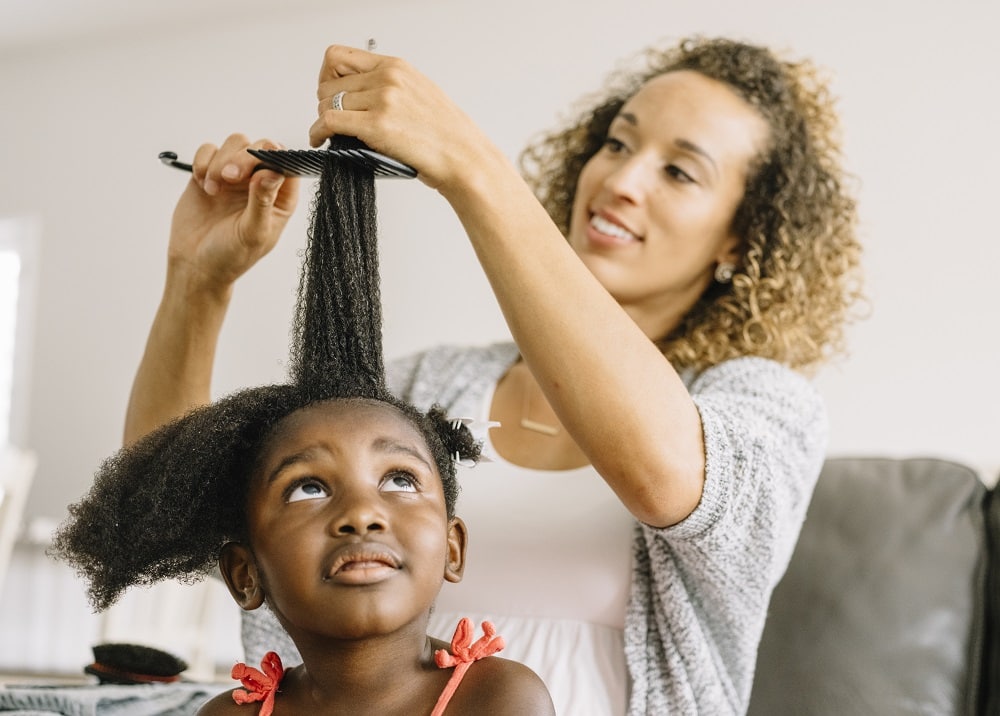 how to care for kid's textured hair - detangling with wide tooth comb