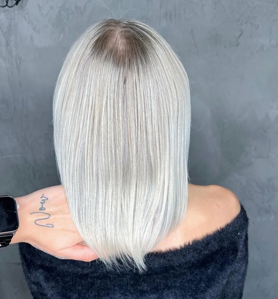icy blonde hair with dark roots