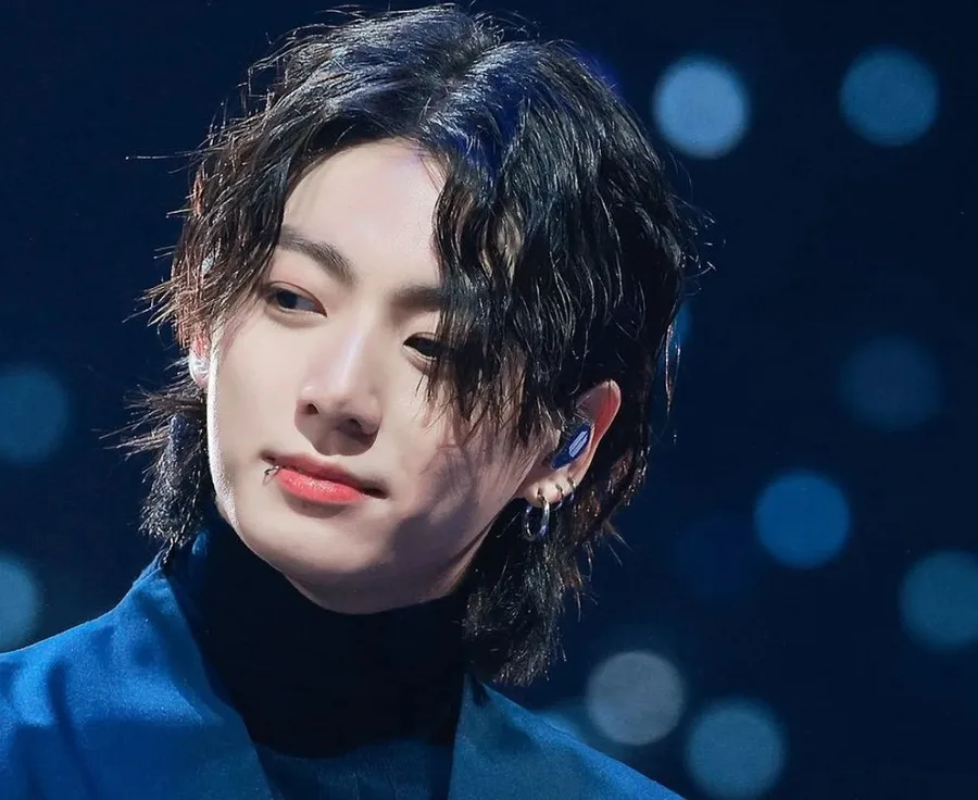 jungkook with wavy hairstyle