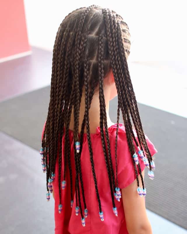 little girl's box braids style with beads