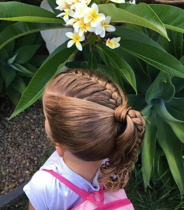 kid with french braided ponytail