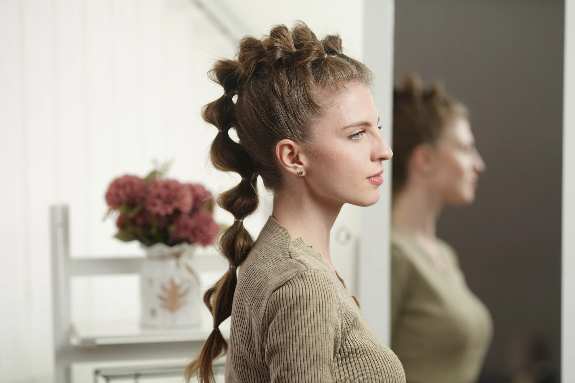 Laced bubble braid tutorial: side view of the finished ribbon-laced bubble braid ponytail