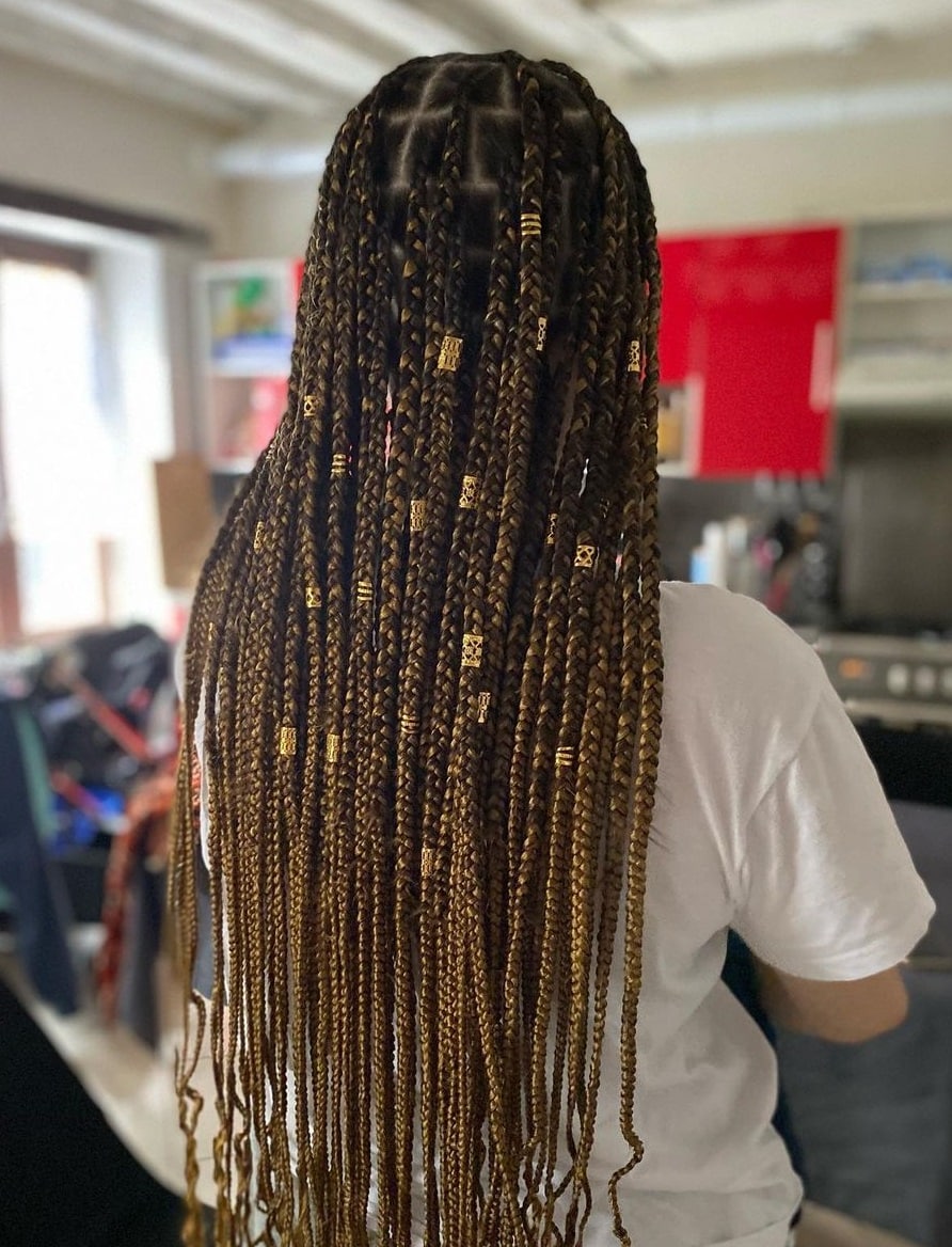 large brown knotless braids with beads